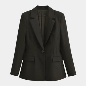 Blazer feminino acinturado de alfaiataria preto com lapela clássica, botão único e modelagem elegante estruturada.